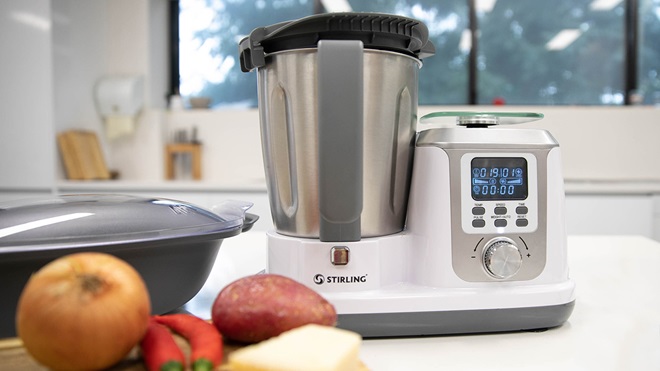 Aldi Stirling thermo cooker sitting on a white kitchen benchtop with food beside it